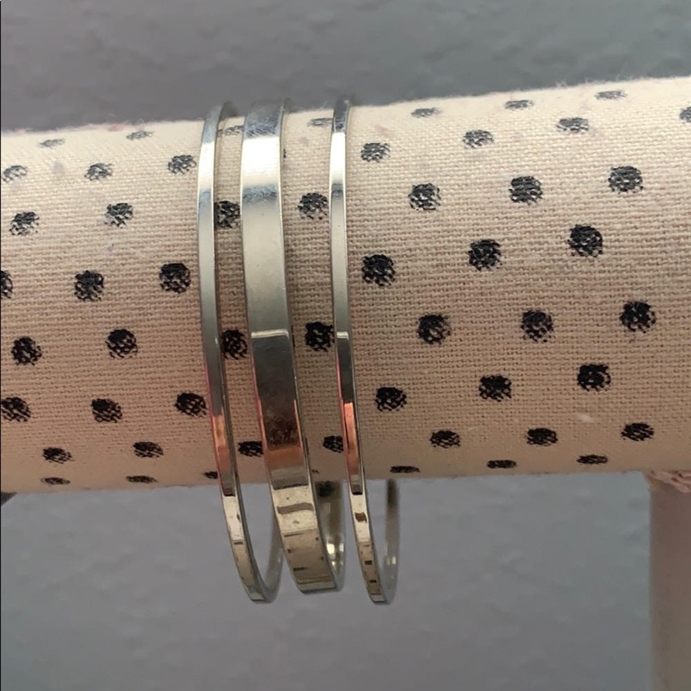 Set of silver costume bangle bracelets
